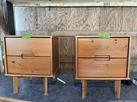 Two mid century style wooden side drawers, each with two drawers, shown side by side.