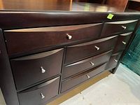 Front angle photo showing the dresser's width and drawer layout.