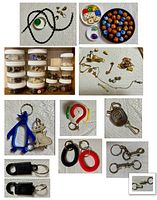 Assortment of metal trinkets, keychains, dice, buttons in jars, and novelty plastic key rings shown on a textured white surface.