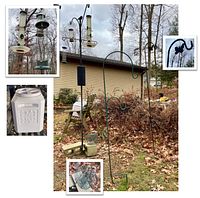 Overview image showing all bird feeder stands, feeders, suet feeder, and Gamma Seal pet food container with scoop in the background outdoors on leaf-covered ground