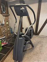 Front angled view of the Precor 5.23 elliptical trainer showing frame, handlebars, and foot pedals.