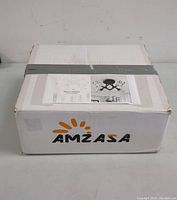 Photo of the Amzasa branded box showing package condition and brand name.
