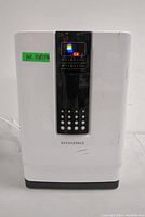 Front view of the white Hathaspace air purifier with a black digital control screen, several scratches visible on the front panel.