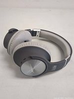 Side angled view of black wireless Altec Lansing R3volution X Bluetooth headphones showing the over-ear cushioned ear cup and headband.