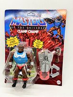 Image of new sealed Clamp Champ figure from Masters of the Universe in original packaging with visible bent cardboard backing.