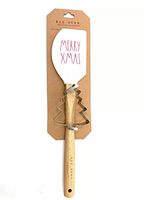 New Rae Dunn Merry Xmas spatula with attached Christmas tree-shaped cookie cutter on original cardboard backing