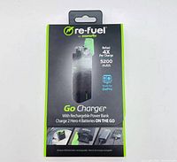 Photo of the Re-Fuel Go Charger retail box showing product name, battery capacity of 5200mAh, and compatibility with GoPro Hero 4 batteries. Box highlights ability to charge 4 times per power bank charge.