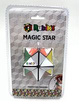 Photo of the Rubik's Magic Star puzzle in clear sealed blister packaging showing colorful star shaped sections and branding on background card