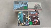 Four trading card sets shown from front: Final Fantasy box, Game of Thrones box, King Kong pack, Shadow Hawk pack.
