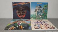 Four Savoy Brown vinyl LP albums visible with their cover artwork laid out on a table.