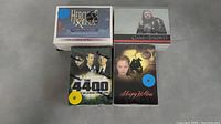 Four packages of trading cards: Hercules & Xena, Game of Thrones, The 4400, and Sleepy Hollow, shown from the front with cover artwork.