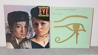 Two vinyl LP album covers side by side: 'Eve' with two women wearing black hats and netting, and 'Eye in the Sky' with a simple gold Egyptian eye symbol on green.