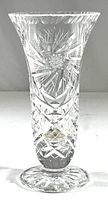 Full view of the heavy cut crystal vase showing the flared top and pedestal base, displaying overall shape and size.