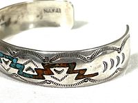 Close-up of the inlay design and engraved silverwork with 'NAKAI' stamp visible.