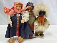 Photo of three ethnic dolls showing Russian, Native American, and Inuit styles together.