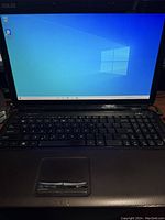 Open laptop turned on displaying Windows 10 desktop screen.