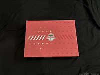 Closed red Toronto FC collector's box with team logo and design elements.