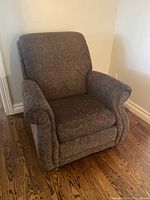 Full side view of La-Z-Boy armchair showing fabric and arm design.