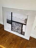 Full view of IKEA VAREKIL photo frame showing its white color, geometric multi-photo layout and overall design.