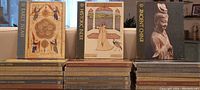 Stacked set of books with front covers visible for Early Islam, Historic India, and Ancient China volumes, highlighting the colorful illustrated dust jackets for several volumes and titles.