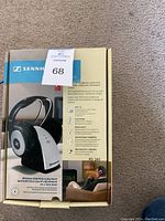 Closed box of Sennheiser RS140 wireless headphones showing front with product image and branding.