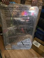 Photo showing the full mirror with safety warning text visible on the protective film.