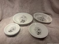 Full view of all plates in the set, showing design and quantity.