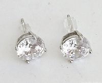 Front view of the stud earrings showing round cubic zirconia stones in silver prong settings.