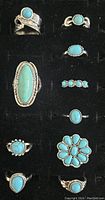 Photo showing 10 silver-tone Southwest fashion rings each set with turquoise-like stones, varying in shape and size.