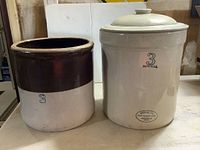 Two vintage 3 gallon crocks; left brown/white crock without lid, right cream colored crock with lid and Medalta Potteries Ltd. mark