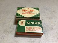 Closed original boxes for Singer Zigzag Attachment and Blind Stitch Attachment
