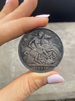 Reverse side showing St. George slaying the dragon with date '1887' at base