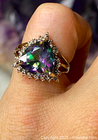 Front view on finger showing triangular mystic topaz and surrounding diamonds