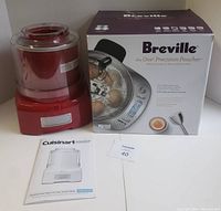 Cuisinart ICE-21 Ice Cream Maker and Breville Precision Poacher box displayed with instruction manual.