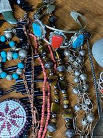 Detail of mixed bead necklaces and carved pendants