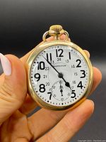 Front view of Hamilton gold-filled pocket watch showing dial and case