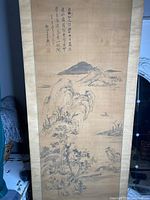 Full front view of mounted scroll showing entire landscape painting