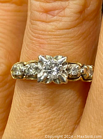 Front view of ring worn on finger