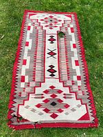 Overhead view of entire blanket showing geometric pattern, colors and overall condition