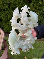 Front-facing view showing entwined dragon and carp with swirling motifs