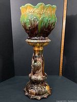 Full assembled two-piece jardiniere showing overall form, glaze colors, and decorative motifs