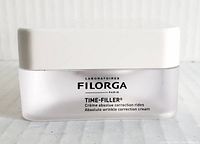 Front of cream jar showing brand and product name