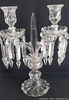 Frontal view of two-light crystal candelabra showing overall form and design