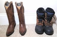 Pair of Ariat cowboy boots and Kamik winter boots displayed side by side on carpeted floor