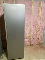 Front view of stainless steel cabinet with Samsung logo and vertical handle