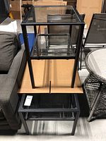 Both coffee table and side table stacked illustrating size and glass shelves.
