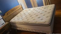 Assembled queen bed set with headboard, mattress, box spring and side rails