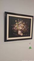 Frontal view of the framed floral painting showing the full artwork and signature.