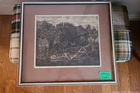 Full view of the framed signed numbered print with brown matting showing rustic barn scene.