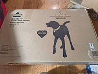 Closed cardboard box with Bissell branding and SpinWave Hard Floor Expert robotic vacuum text with dog silhouette on top surface.